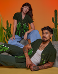Alex is wearing Paintstamped Pantry Button-Up in Cactus. Jesse is wearing Paintstamped Pantry Button-Up in Cactus and matching Work Pants