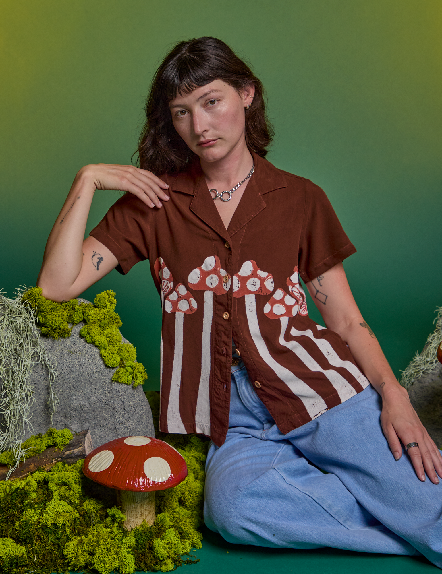 Alex is wearing Paintstamped Pantry Button-Up in Mushroom