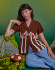 Alex is wearing Paintstamped Pantry Button-Up in Mushroom