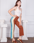 Alex is 5'8" and wearing XS Hand-Painted Stripe Western Pants in Burnt Terracotta paired with a vintage off-white Tank Top