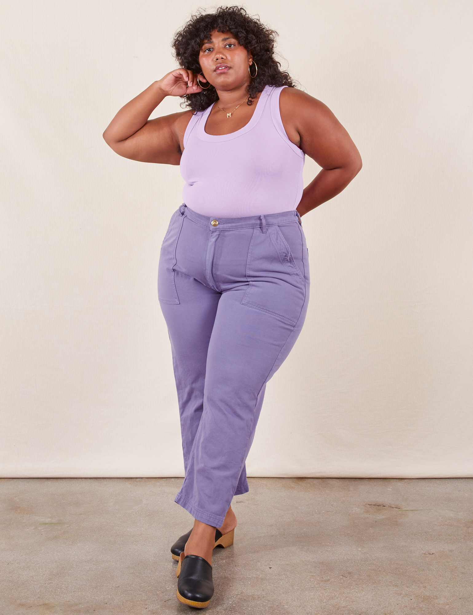 Morgan is 5&#39;5&quot; and wearing Petite 1XL Work Pants in Faded Grape paired with lilac purple Tank Top
