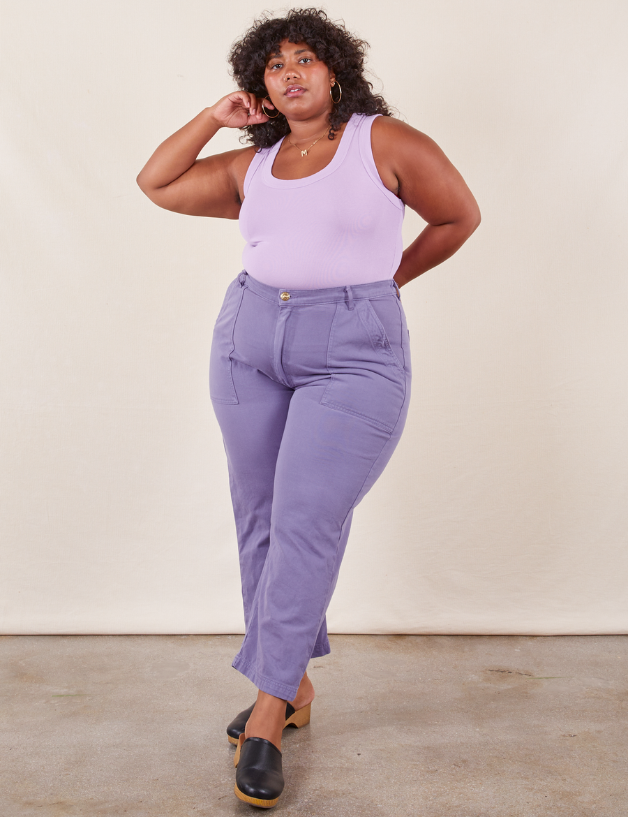 Morgan is 5'5" and wearing Petite 1XL Work Pants in Faded Grape paired with lilac purple Tank Top