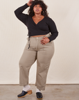 Morgan is 5'5" and wearing Petite 1XL Work Pants in Khaki Grey paired with black Wrap Top
