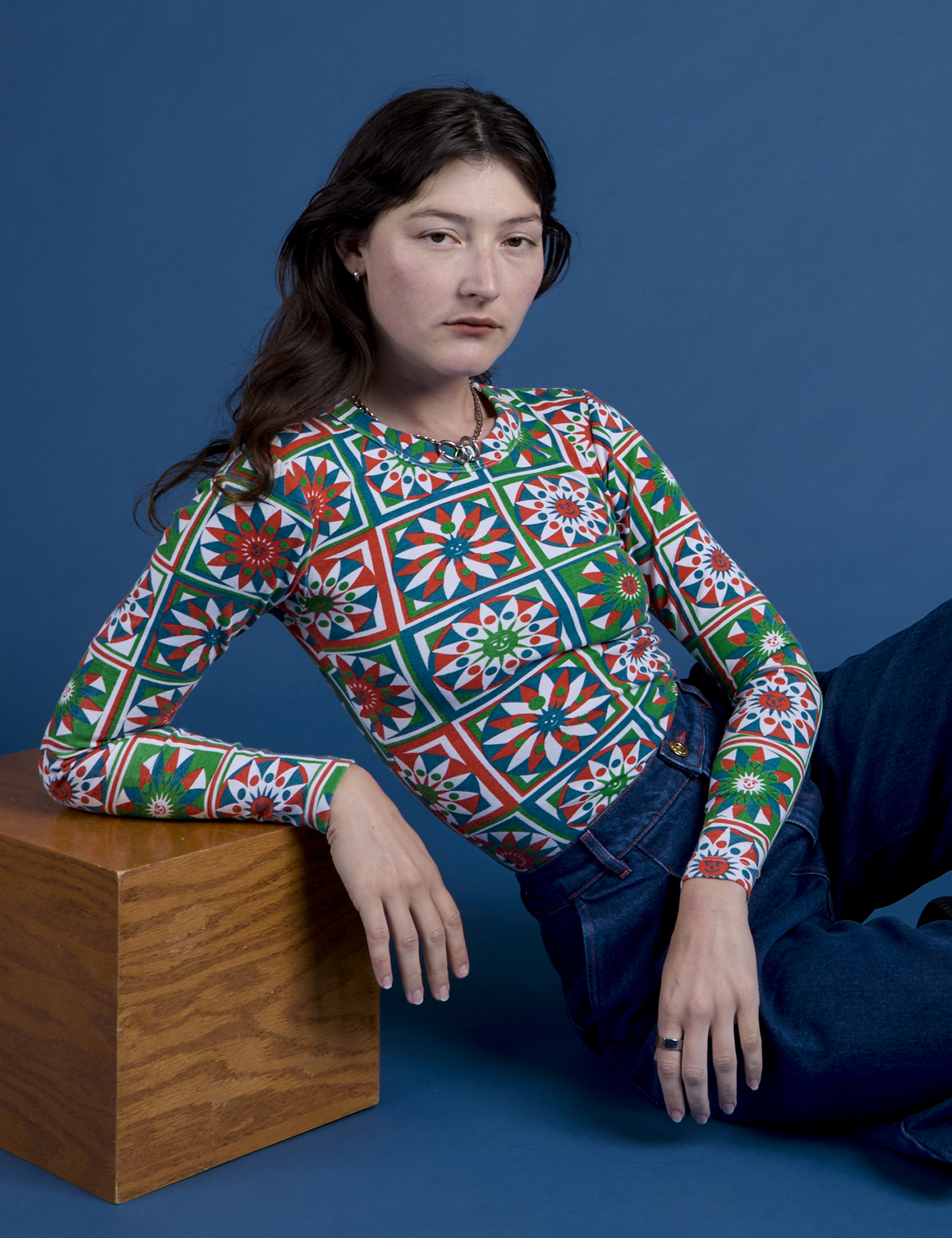 Alex is wearing Long Sleeve Baby Tee in Quilt Print