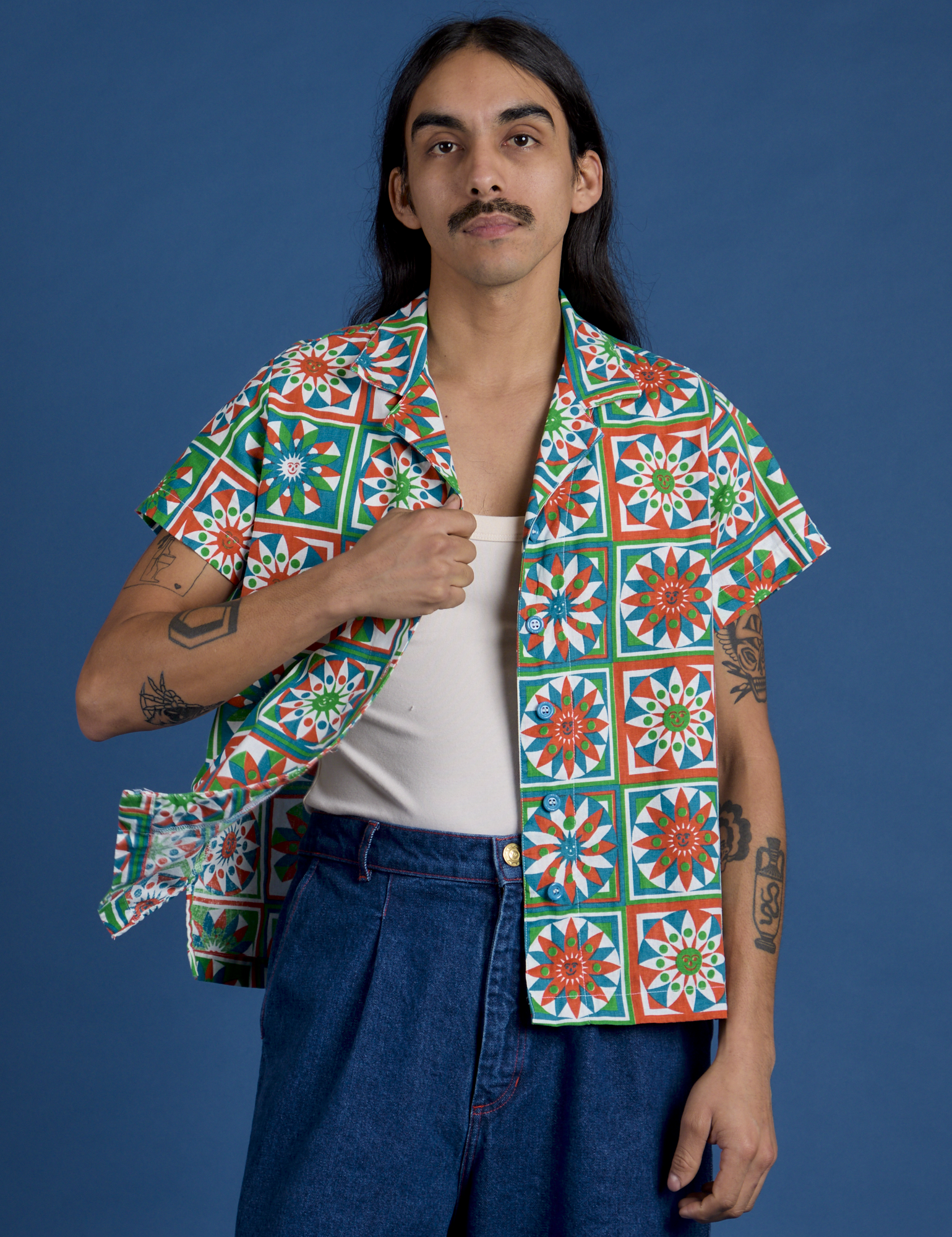 Anthony is 5’6” and wearing S Quilt Print Pantry Button-Up