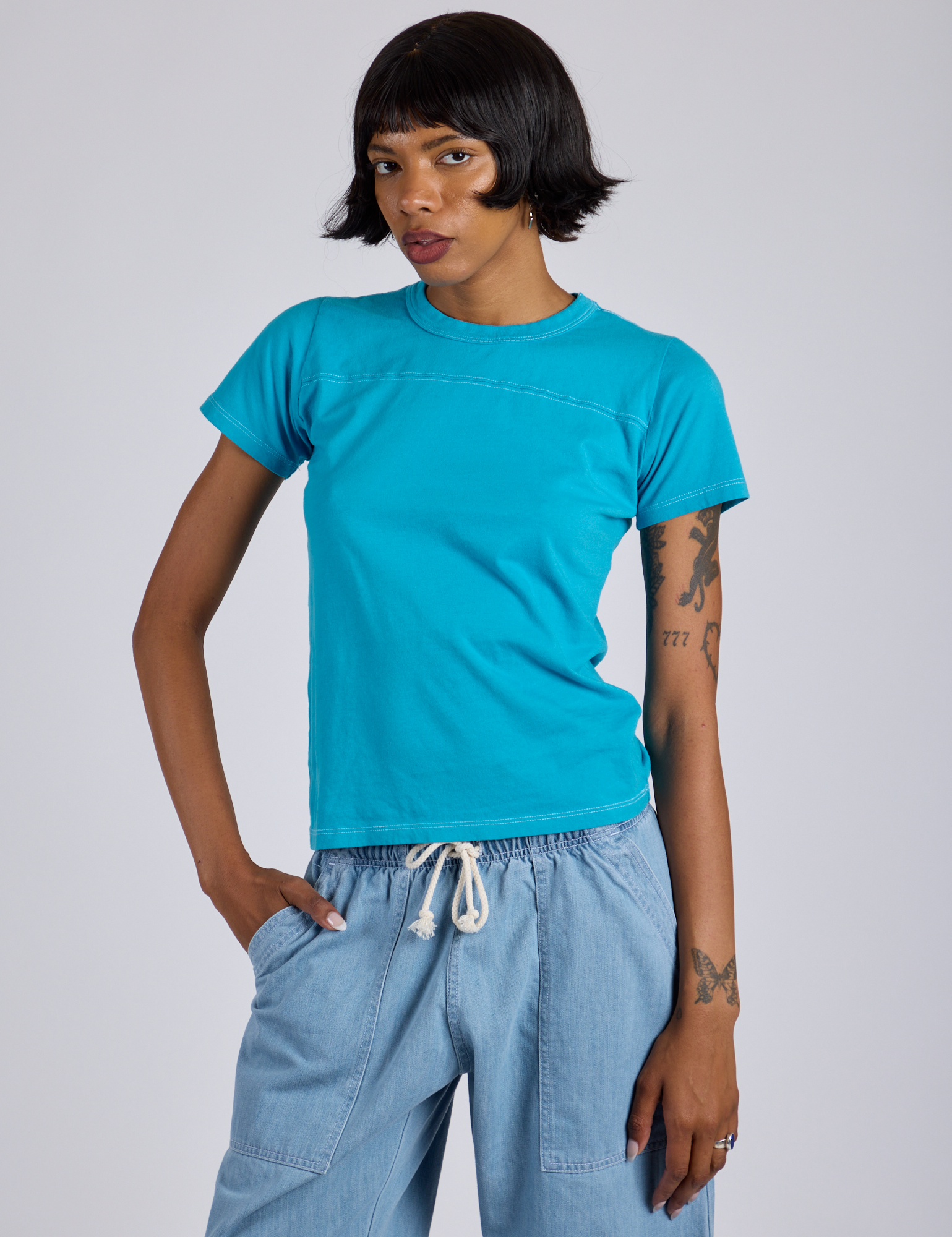 Kira is 5’10” and wearing P Jr. Varsity Tee in Hawaiian Blue