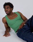 Isaac is wearing Cropped Tank Top in Seafoam Green