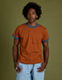 Jerrod is 6’3” and wearing M Vintage Ringer Tee in Burnt Terracotta