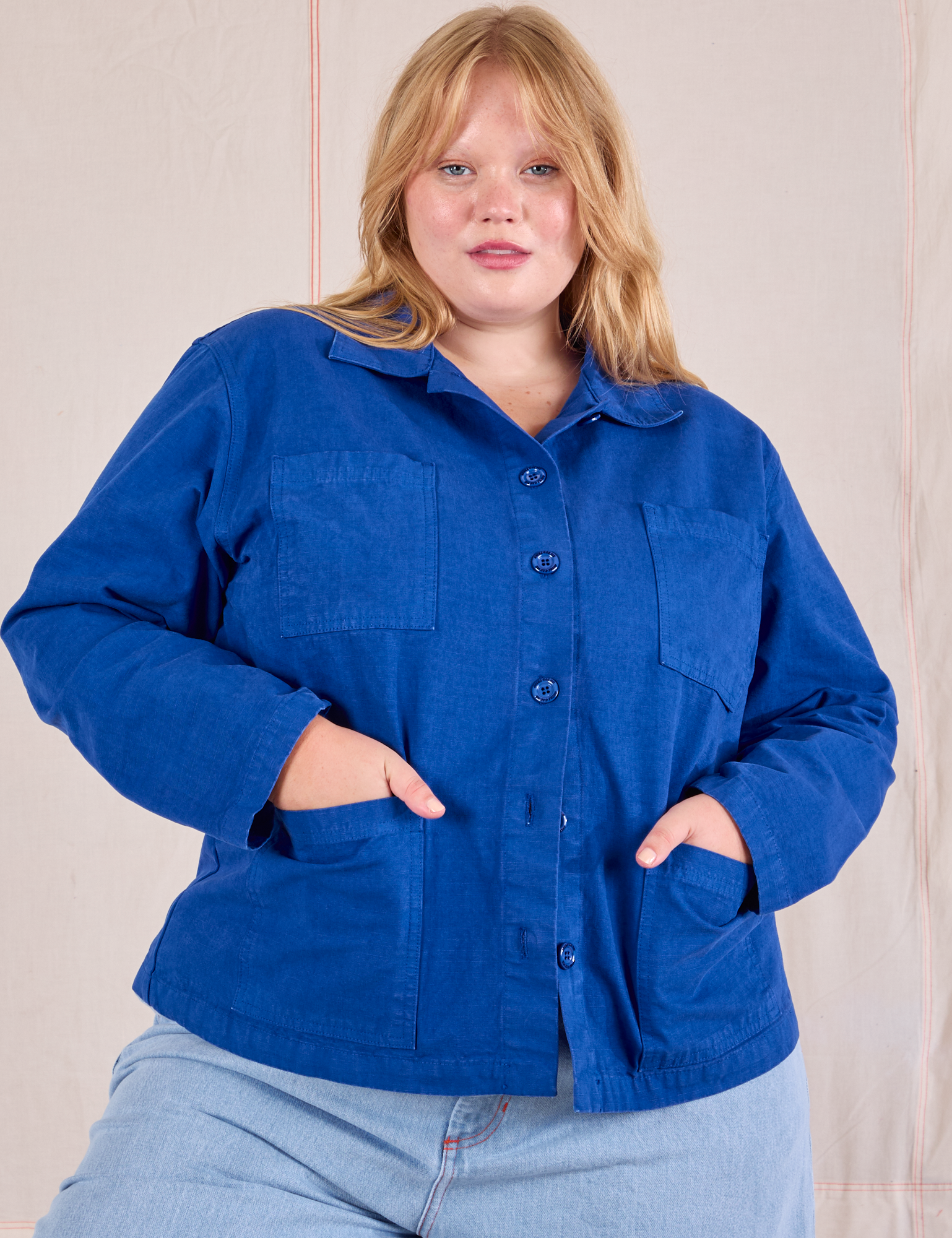 Juliet is 5'7" and wearing XL Ripstop Work Jacket in Royal Blue