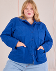 Juliet is 5'7" and wearing XL Ripstop Work Jacket in Royal Blue