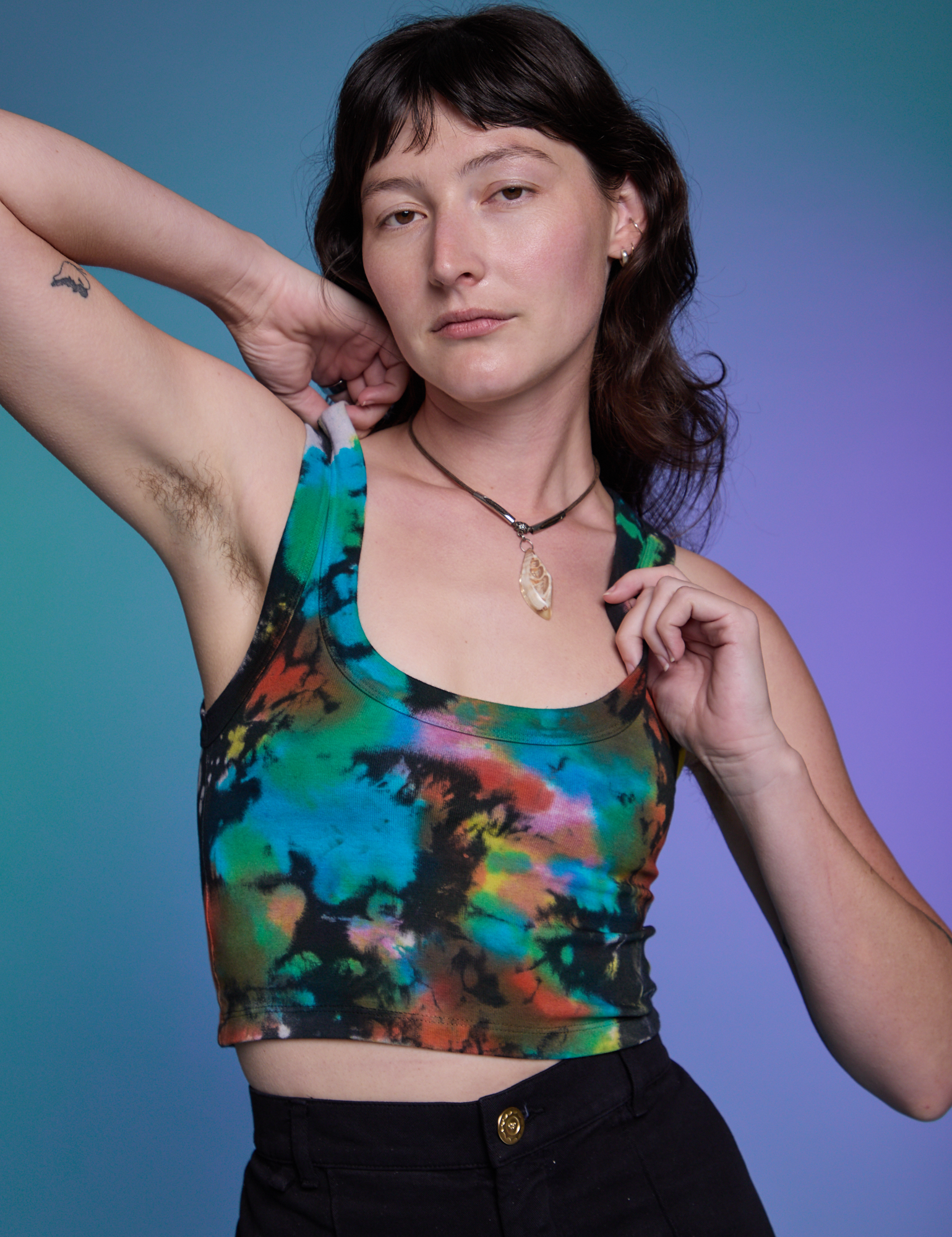 Alex is 5'8" and wearing P Rainbow Magic Waters Cropped Tank