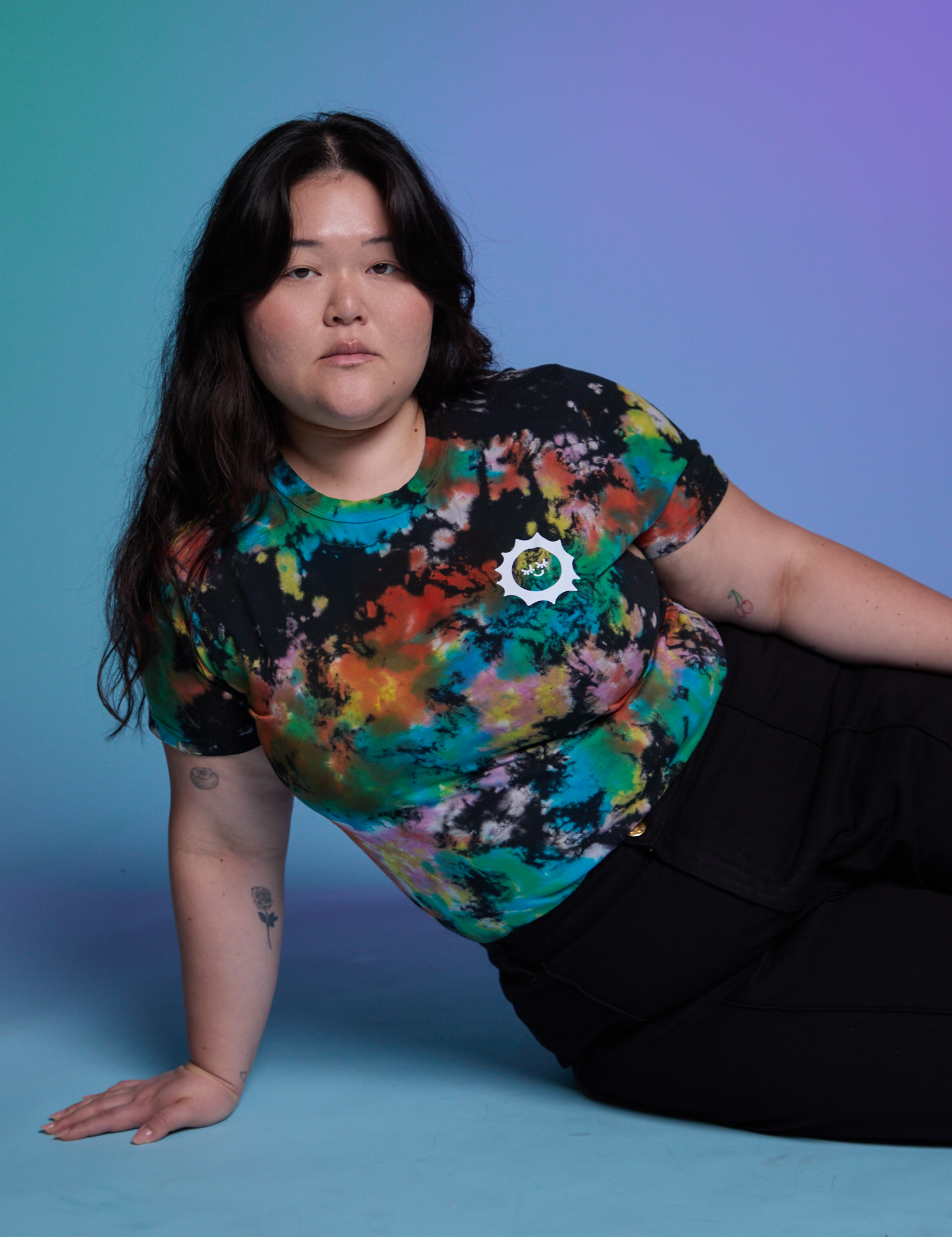 Ashley is wearing Classic Tee in Rainbow Magic Waters
