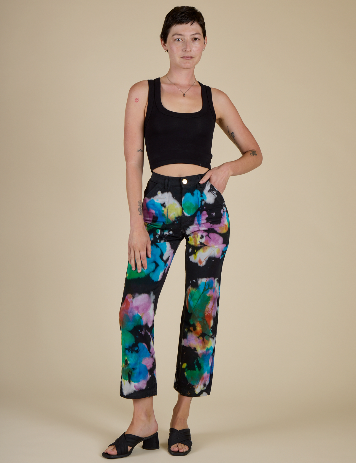  Alex is 5’8” and wearing XXS Rainbow Magic Waters Work Pants with black cropped tank