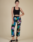  Alex is 5’8” and wearing XXS Rainbow Magic Waters Work Pants with black cropped tank