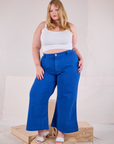 Juliet is 5'7" and wearing 1XL Bell Bottoms in Royal Blue paired with a Cami in Vintage Tee Off-White