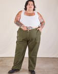 Sam is 5'10 and wearing 4XL Work Pants in Surplus Green paired with a Cropped Tank in vintage tee off-white