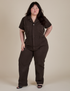 Ashley is 5'7" and wearing 1XL Short Sleeve Jumpsuit in Espresso Brown
