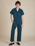 Quinn is 6'3" and wearing L Short Sleeve Jumpsuit in Lagoon
