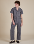 Quinn is 6'3" and wearing L Short Sleeve Jumpsuit in Washed Grey