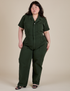 Ashley is 5'7" and wearing 1XL Short Sleeve Jumpsuit in Swamp Green