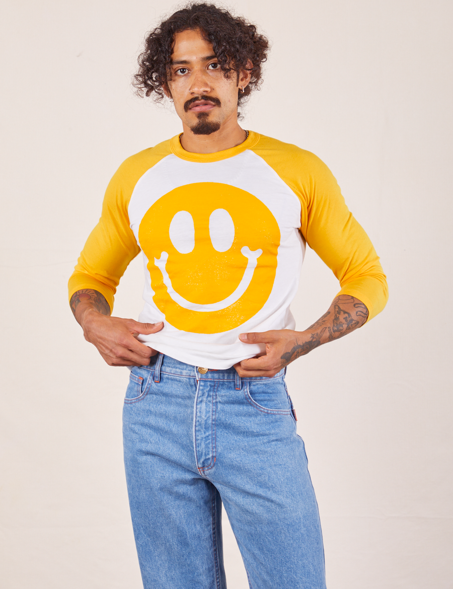 Jesse is 5'8" and wearing XS Paintstamp Smiley Raglan Tee