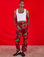 Jerrod is 6'3" and wearing M Paintstamped Work Pants in Cherry paired with a Cropped Tank in vintage tee off-white