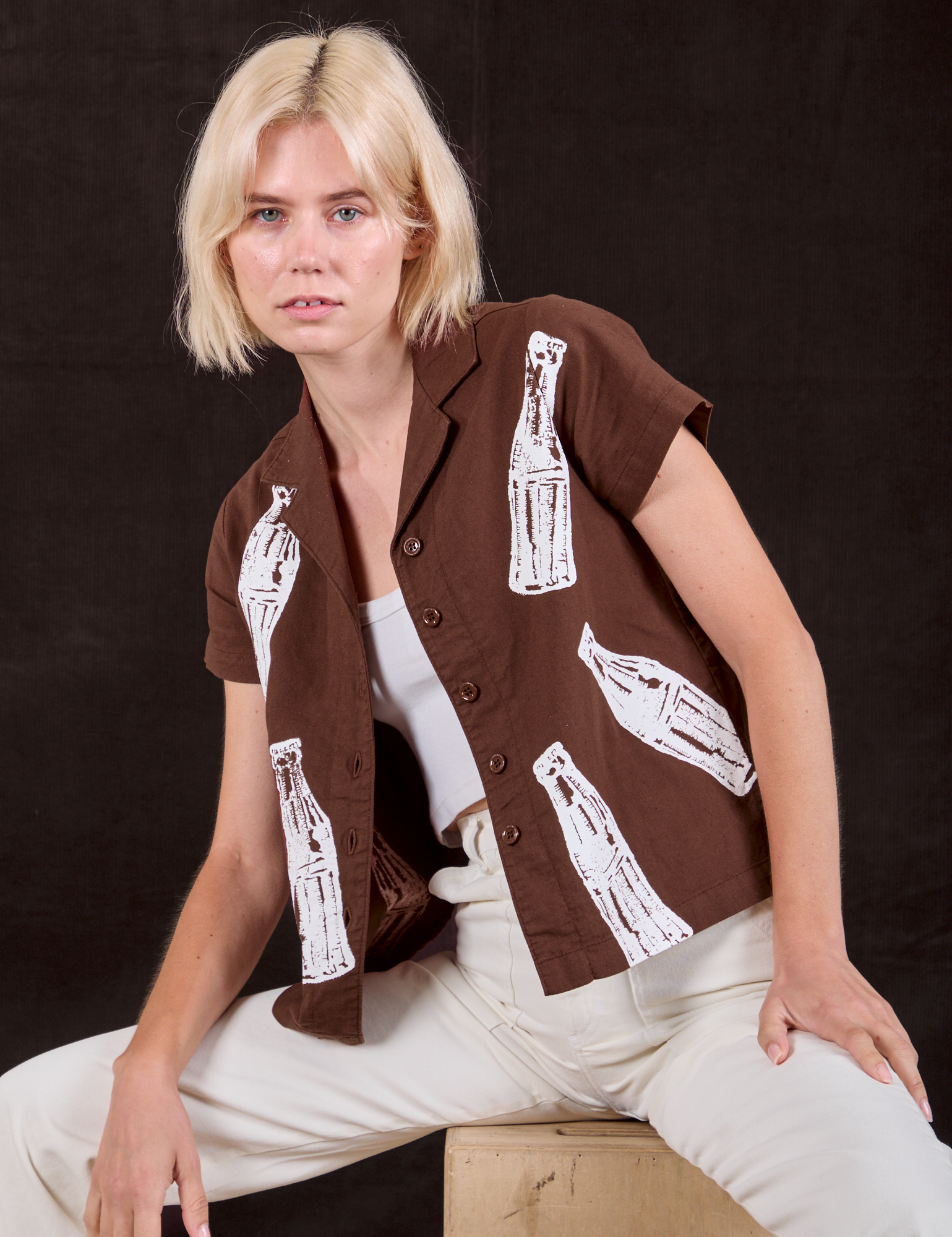 Madeline is wearing Soda Bottle Pantry Button-Up in Fudgesicle Brown