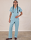 Anthony is 5'10" and wearing S Short Sleeve Jumpsuit in Baby Blue
