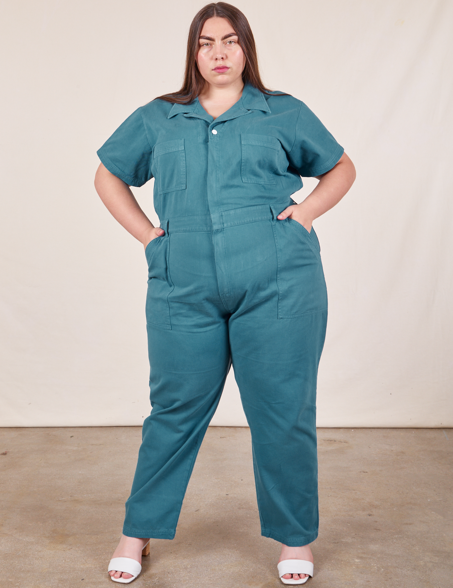 Marielena is 5’8” and wearing 2XL Short Sleeve Jumpsuit in Marine Blue