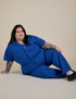Sam is wearing Short Sleeve Jumpsuit in Royal Blue