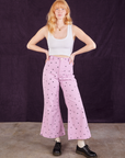 Margaret is 5'11" and wearing XXS Star Bell Bottoms in Lilac Purple paired with a Cropped Tank in vintage tee off-white