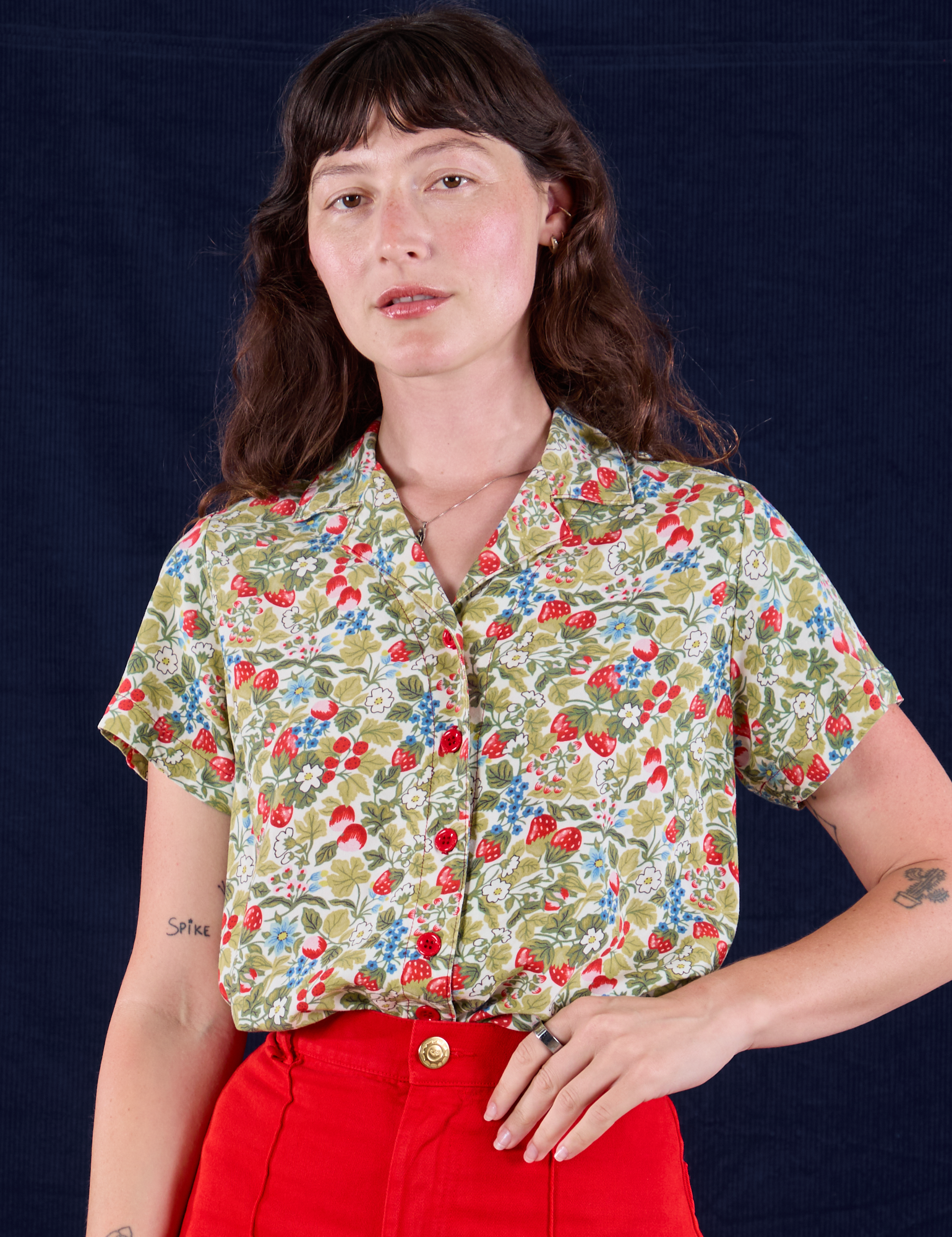 Alex is 5'8" and wearing P Off-White Strawberry Pantry Button-Up