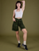 Alex is 5’8” and wearing XXS Longline Work Shorts in Evergreen paired with vintage tee white Cropped Tank