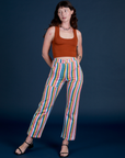 Alex is 5’8” and wearing XXS Work Pants in Rainbow Stripe paired with a burnt terracotta Cropped Tank