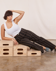 Tiara is wearing Black Striped Work Pants in Espresso and vintage off-white Cropped Tank Top.