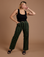 Tiara is 5’4” and wearing S Black Stripe Work Pants in Evergreen paired with a black Cropped Tank