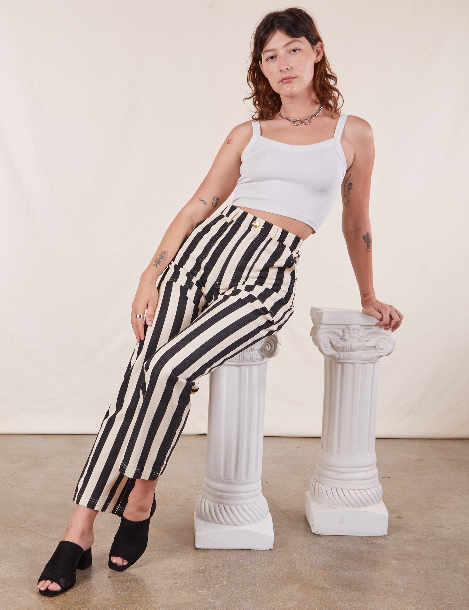 Alex is wearing Black Striped Work Pants in White and vintage off-white Cropped Cami