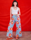 Alex is 5'8" and wearing XXS Wide Leg Denim Trousers in Painted Flowers paired with a Cropped Tank in Vintage Tee Off-White