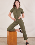 Alex is wearing Short Sleeve Jumpsuit in Surplus Green