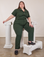 Marielena is wearing Short Sleeve Jumpsuit in Swamp Green