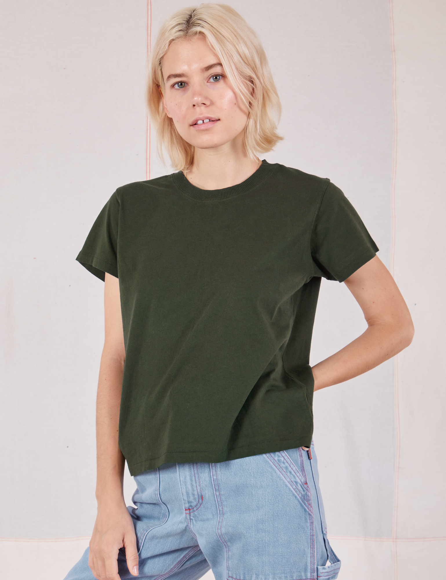 Madeline is 5&#39;9&quot; and wearing P Organic Vintage Tee in Swamp Green