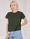 Madeline is 5'9" and wearing P Organic Vintage Tee in Swamp Green