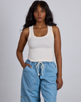Kandia is 5’4” and wearing P The Tank Top in Vintage Tee Off-White