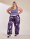 Juliet is 5'7" and wearing 1XL Magic Waters Drop Pocket Pants in Dark Lavender paired with faded grape Cropped Tank