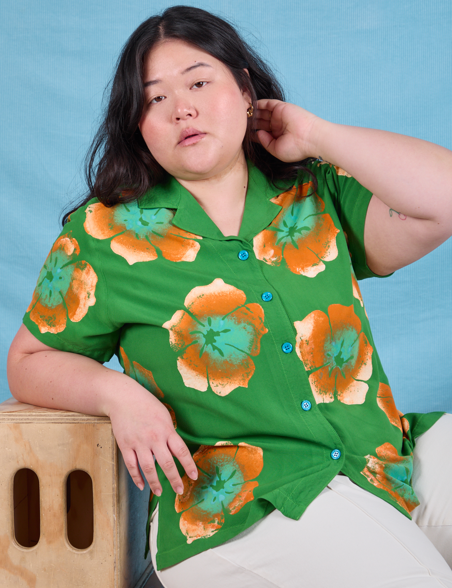 Ashley is wearing Paintstamped Pantry Button-Up in Kelly Green