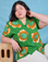 Ashley is wearing Paintstamped Pantry Button-Up in Kelly Green