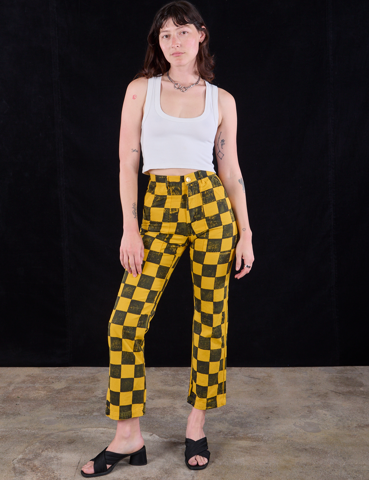 Alex is 5'8" and wearing XS Checkboard Taxi Work Pant paired with a Cropped Tank in Vintage Tee Off-White