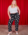 Juliet is 5'7" and wearing 1XL Paintstamped Heart Work Pants in Black paired with a Cropped Tank in vintage tee off-white