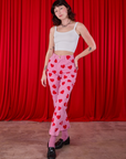 Alex is 5'8" and wearing XXS Paintstamped Heart Work Pants in Bubblegum Pink paired with Cami in vintage tee off-white