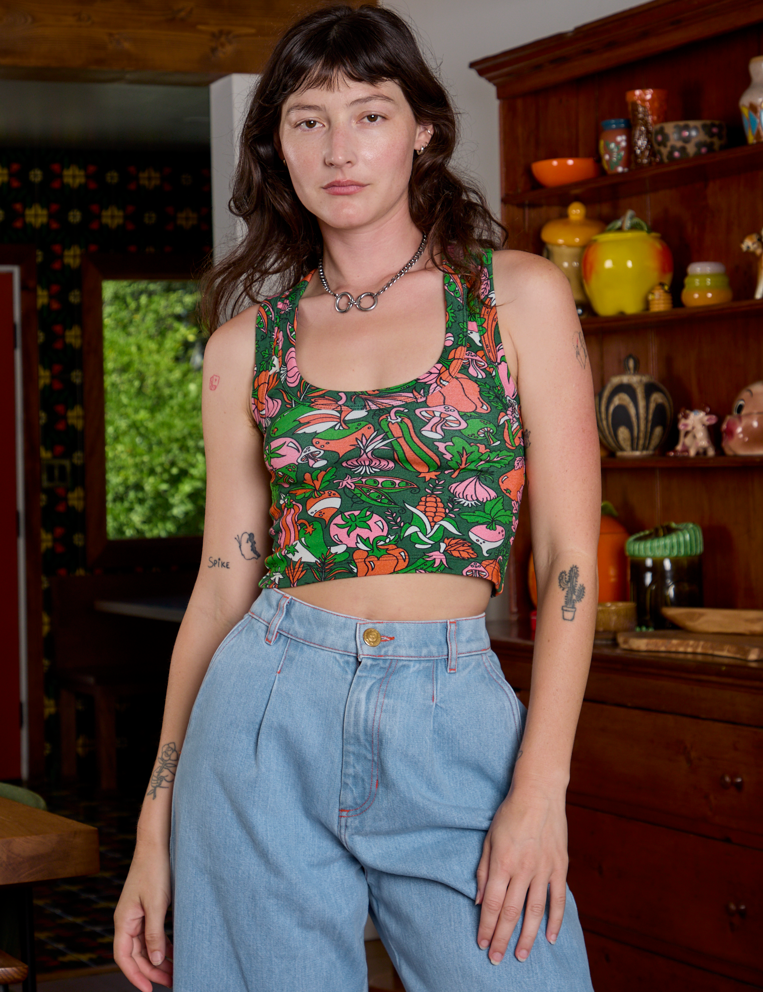 Alex is is 5'8" and wearing P Cropped Tank Top in Kitchen Collection